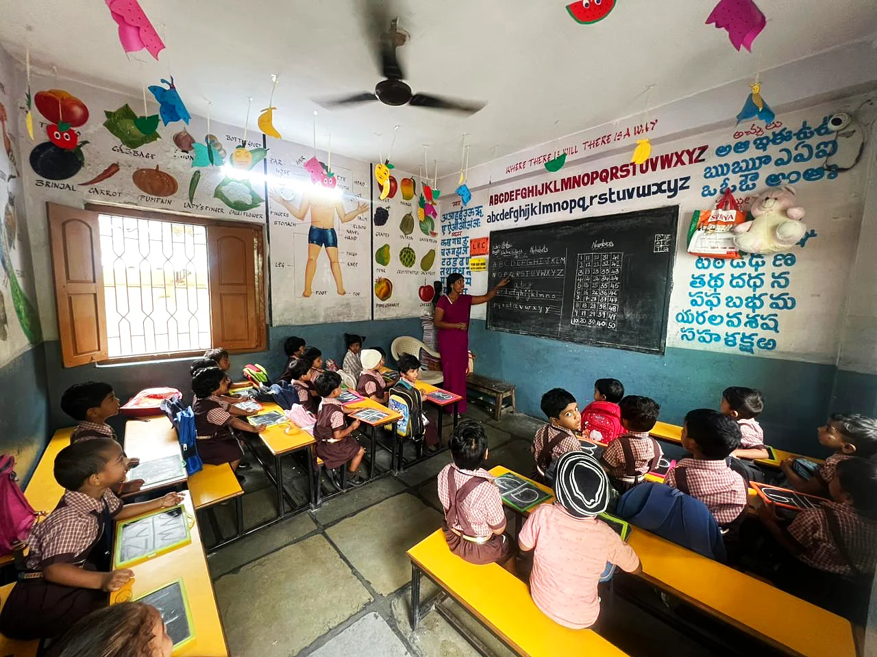 Young students learning in the nursery classroom