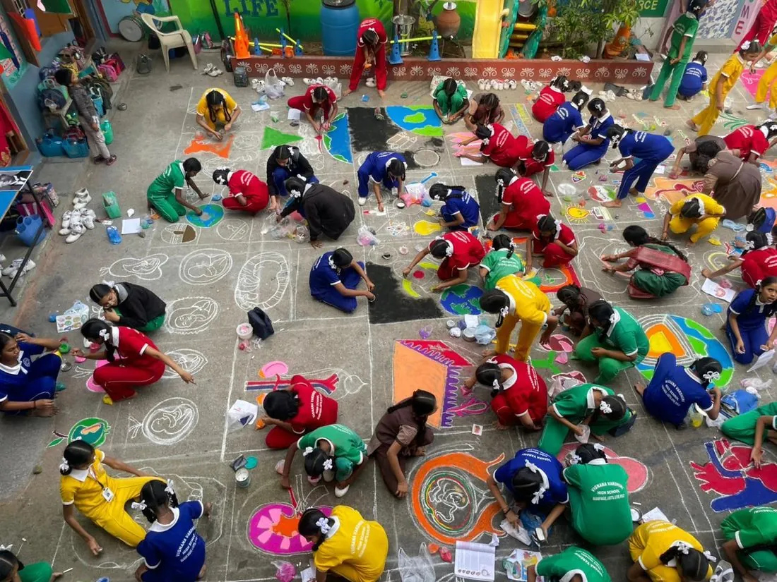 A rangoli competition on the school ground